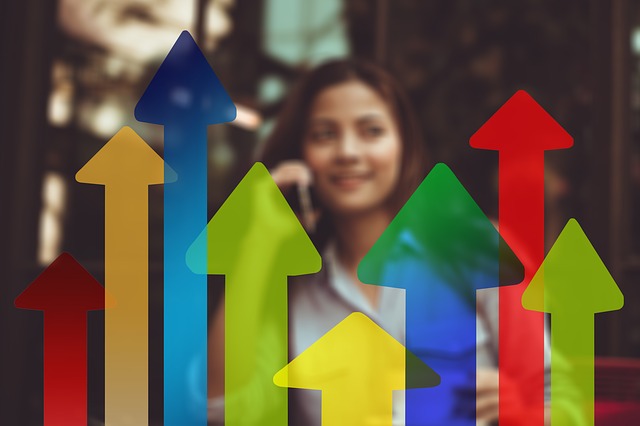 woman sitting and arrows trending up