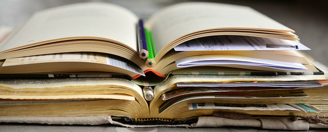 lstack of open books on top of one another