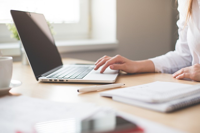 female student sitting and working at computer