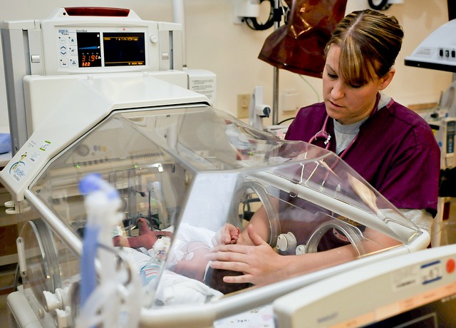 nurse and small baby in hospital