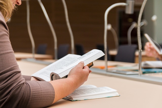woman sitting and reading a book