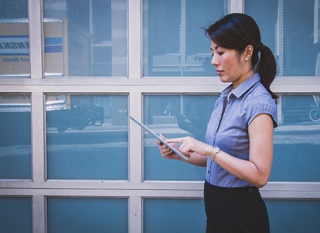 career woman reading tablet