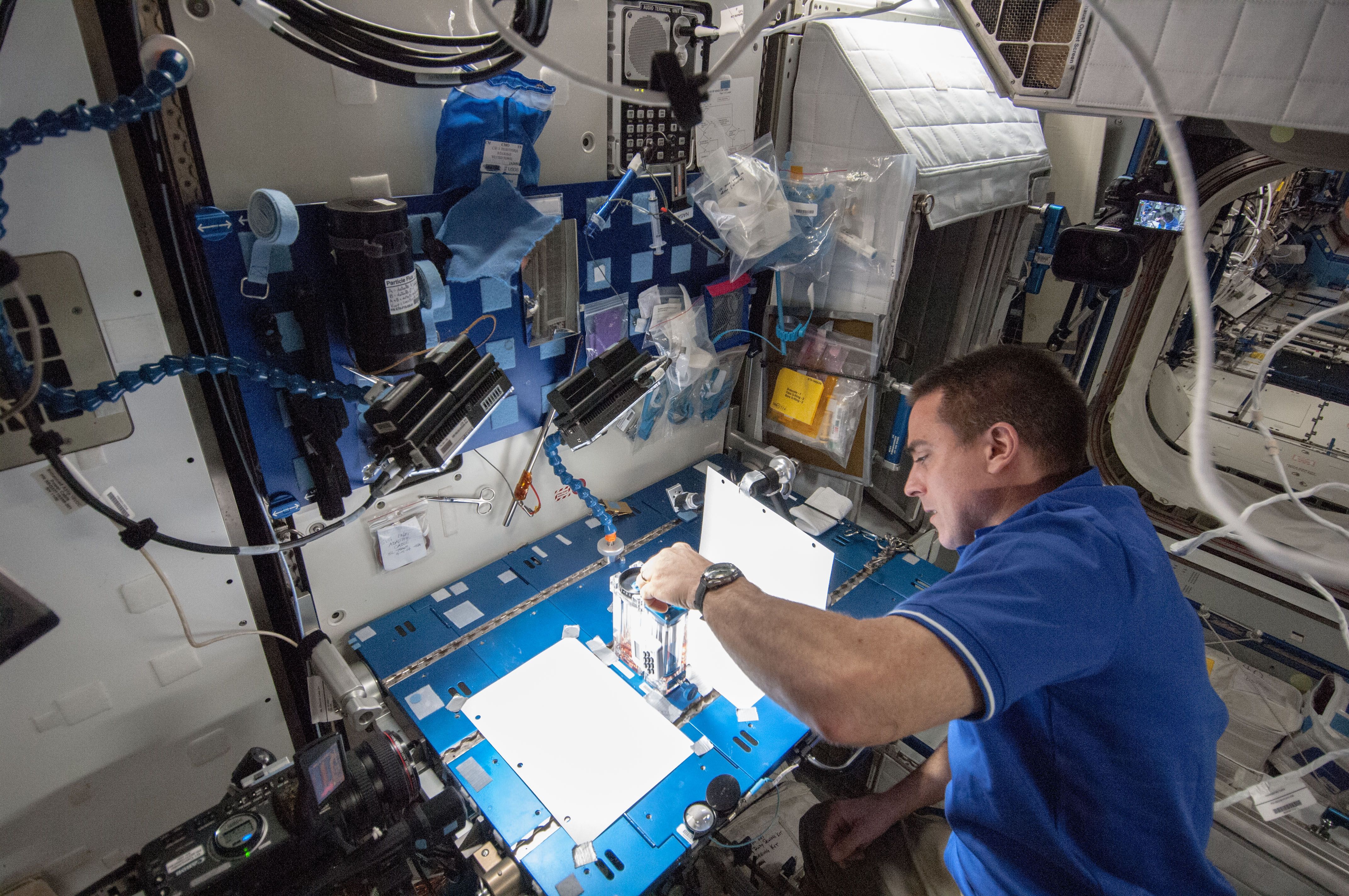 researcher working on a large machine
