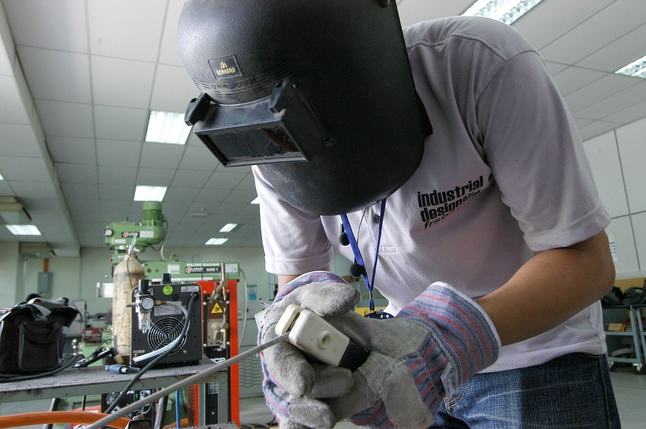 welder doing project welder doing work with his protective helmet on