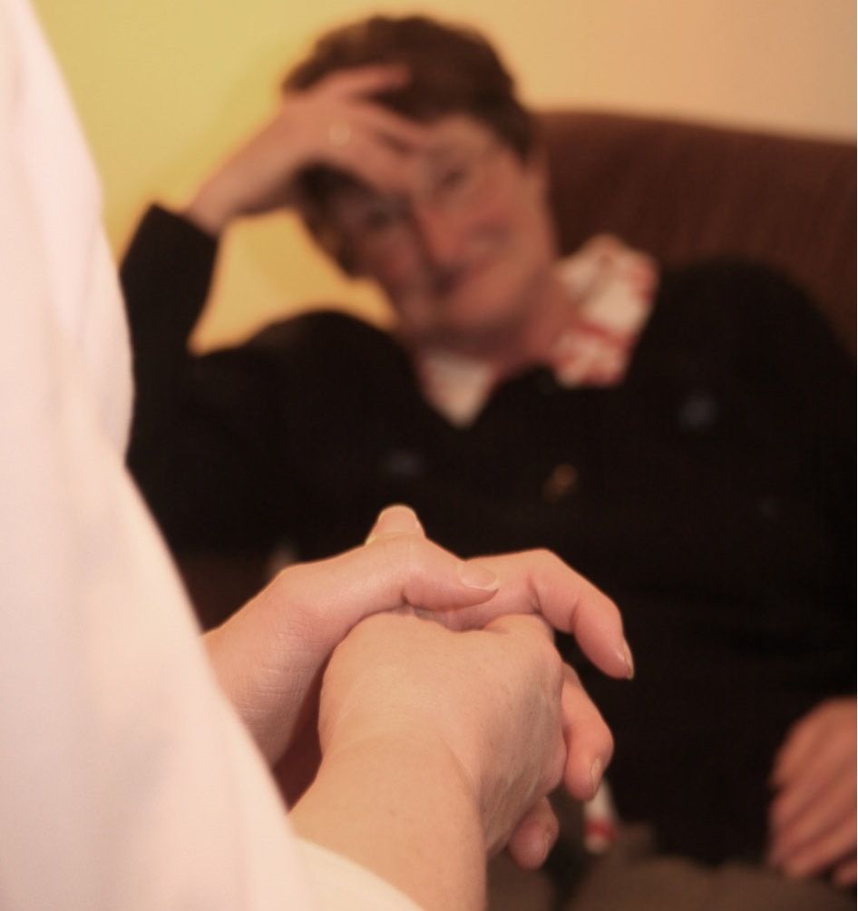 psychiatrist talking to an elderly woman