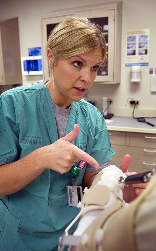 female physical therapist talking